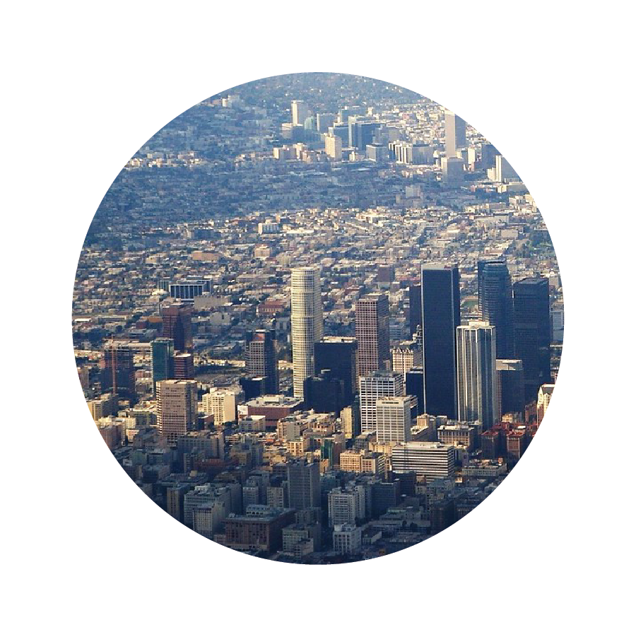 An aerial view of Los Angeles, with tightly packed buildings stretching into the distance.
