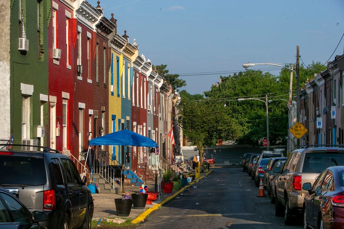 Philadelphia street with brightly colored rowhouses.